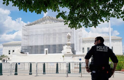 A US Supreme Court police officer stands watch outside of the Supreme Court on June 26 in Washington
