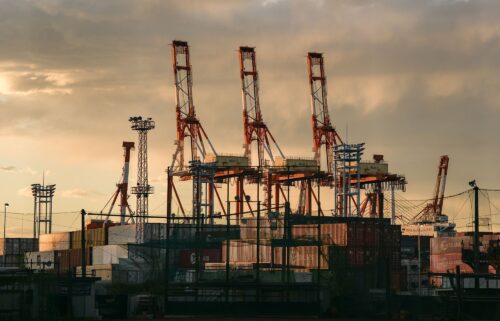 Containers under gantry cranes at a shipping terminal in Yokohama