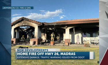 Home damaged by fire off Highway 26 near Madras