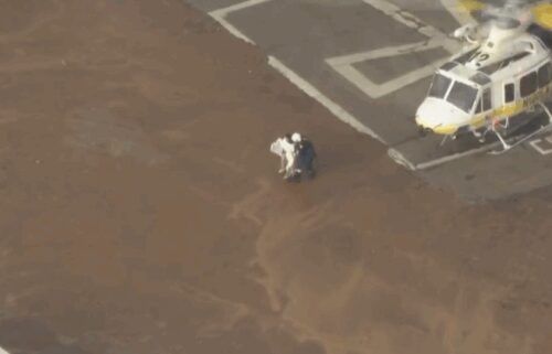Firefighters rescued five people after a flash flood in the San Gabriel Mountains swept them away.