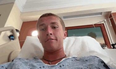 Sam Hollis said a shark grabbed him by the foot and yanked him off his board while he was at New Smyrna Beach.