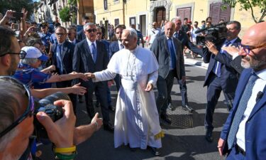 Pope Leo XIV greets people as he arrives for his two-week stay in Castel Gandolfo on July 6.