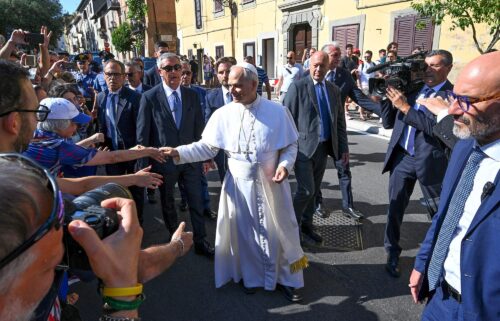 Pope Leo XIV greets people as he arrives for his two-week stay in Castel Gandolfo on July 6.