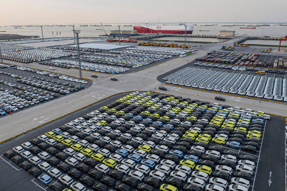 <i>STR/AFP/via Getty Images via CNN Newsource</i><br/>BYD electric cars wait to be loaded to the automobile carrier BYD 