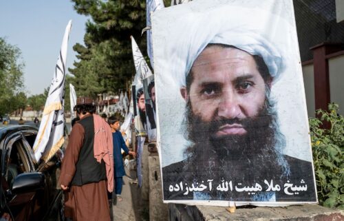 A poster of Taliban Supreme Leader Hibatullah Akhundzada is seen along a road in Kabul on August 14