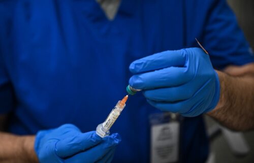 A health worker prepares a dose of the measles vaccine in Lubbock