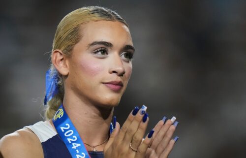 AB Hernandez stands on the podium during a medal ceremony for the triple jump at the California high school track-and-field championships in Clovis