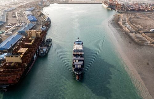 This aerial view shows a container ship cruising at the port of Umm Qasr in Iraq's southern city of Basra. Iraq was among the latest countries to receive a letter from President Donald Trump informing the nation of the rate its goods will be tariffed as of August 1