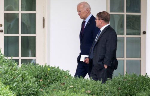 President Joe Biden speaks with White House Physician Kevin O'Connor as he arrives back at the White House in Washington