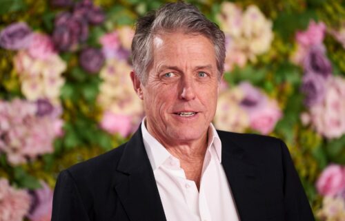 Hugh Grant poses for photographers upon arrival at the World premiere of the film 'Bridget Jones: Mad About the Boy' in London