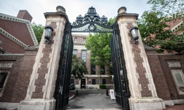 A Harvard University gate opens May 24 to campus in Cambridge
