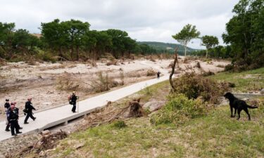Members of Orange County Task Force One search for missing flood victims in Kerrville