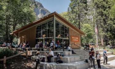 Visitors gather around the Yosemite Valley Welcome Center in Yosemite National Park on May 20.