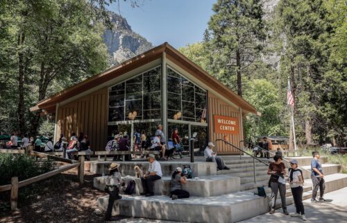 Visitors gather around the Yosemite Valley Welcome Center in Yosemite National Park on May 20.