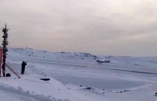 The plane flown by Ethan Guo is seen landing in Antarctica.