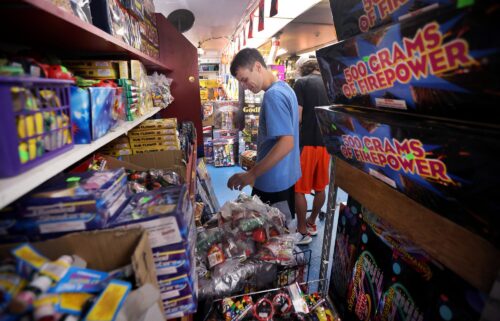Customers shop for fireworks at Uncle Sam's Fireworks on July 1