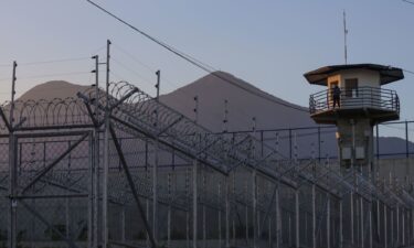 A prison officer stands guard in the watchtower at the Center for Terrorism Confinement (CECOT) in Tecoluca