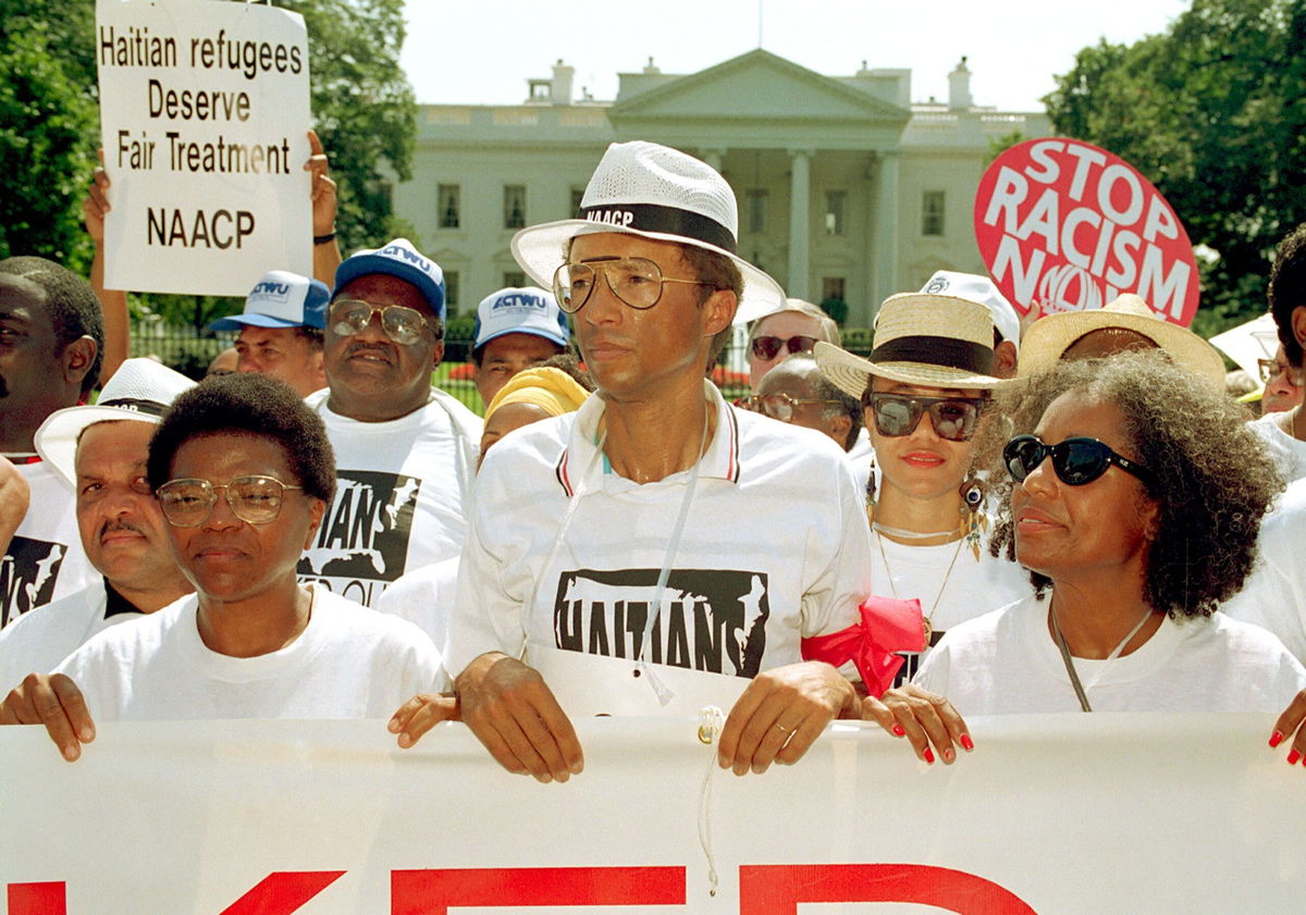 <i>Greg Gibson/AP via CNN Newsource</i><br/>Ashe takes part in a demonstration outside the White House in 1992