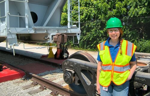 Chloe Lawson stands in front of a railcar on June 9 in Excelsior Springs
