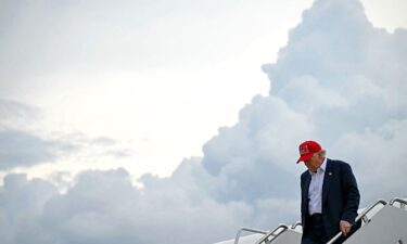 President Donald Trump steps off Air Force One upon arrival at Joint Base Andrews