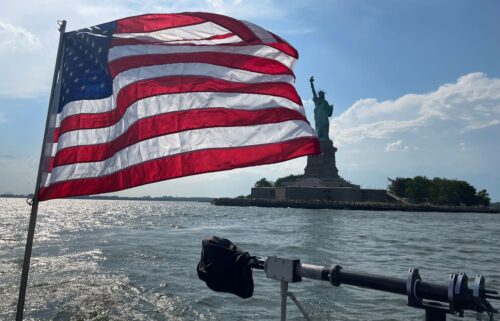 An American flag fles from the back of a NYPD boat on Thursday