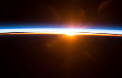 The sun rises over Earth's horizon as seen from the International Space Station.