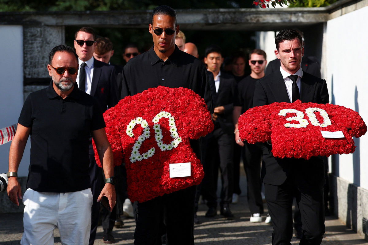 <i>Pedro Nunes/Reuters via CNN Newsource</i><br/>Liverpool captain Virgil van Dijk and left-back Andy Robertson arrive to the funeral with flowers on Saturday morning.