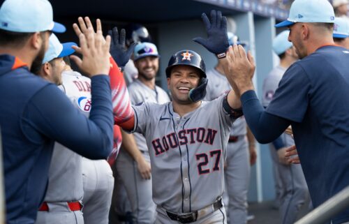 Jose Altuve celebrates in the dugout after his two-run home run in the third inning.