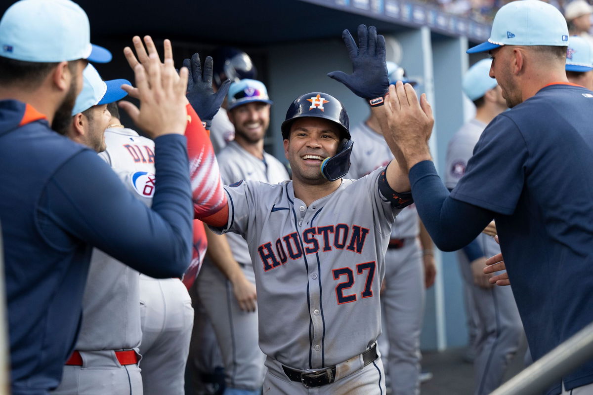 <i>Kyusung Gong/AP via CNN Newsource</i><br/>Jose Altuve celebrates in the dugout after his two-run home run in the third inning.
