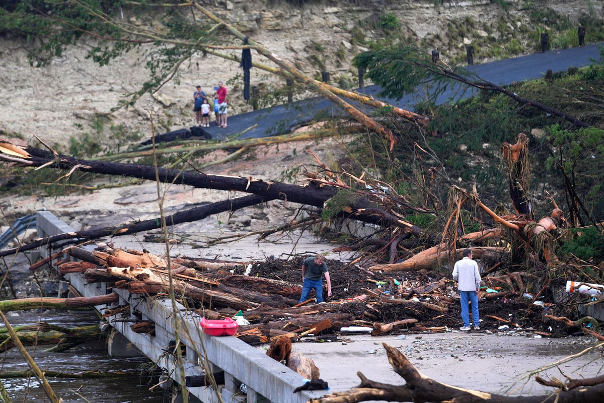 <i>Julio Cortez/AP via CNN Newsource</i><br/>Massive debris impale a bridge over the Guadalupe River on July 5 in Ingram