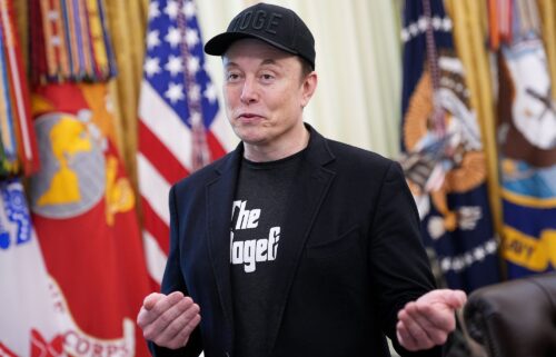 Tesla CEO Elon Musk speaks to reporters alongside President Donald Trump in the Oval Office of the White House in May 2025 in Washington