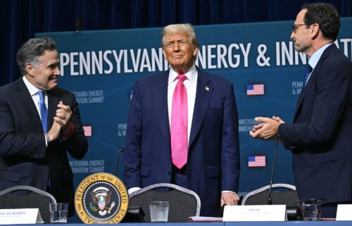 President Donald Trump with Sen. Dave McCormick (L) and CEO of Blackstone Group Jon Gray (R) on the campus of Carnegie Mellon University in Pittsburgh on July 15.