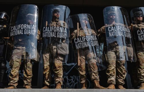 National Guardsmen stand outside of the Edward Roybal Federal Building in downtown Los Angeles