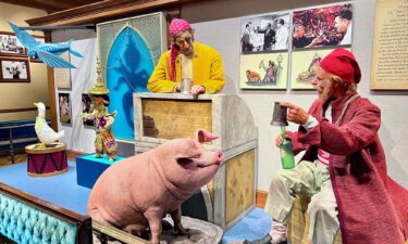 Early Audio-Animatronics from "Pirates of the Caribbean" and "It's a Small World" are on display inside the Main Street Opera House at Disneyland.
