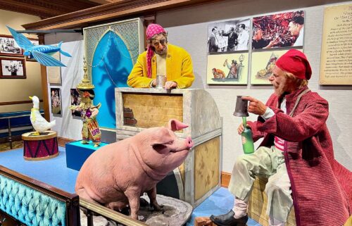 Early Audio-Animatronics from "Pirates of the Caribbean" and "It's a Small World" are on display inside the Main Street Opera House at Disneyland.