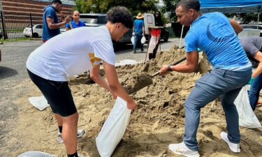Volunteers fill sandbags for New Orleans residents Wednesday anticipating heavy rain from a tropical weather system moving toward the Gulf Coast.