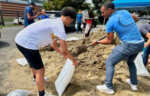 Volunteers fill sandbags for New Orleans residents Wednesday anticipating heavy rain from a tropical weather system moving toward the Gulf Coast.
