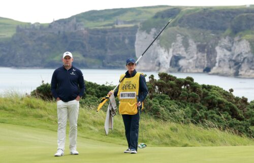 Lee Westwood and his wife Helen Storey on the fifth green on Thursday.