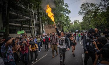A protester lights an aerosol can during a protest against gentrification in Mexico City on July 4. Mexico City officials have announced a 14-point plan to address the capital’s housing and gentrification problems.