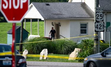 Police assess the scene after a shooting at Richmond Road Baptist Church on July 13