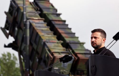 Ukrainian President Volodymyr Zelensky looks on during a visit to a military training area to find out about the training of Ukrainian soldiers on the “Patriot” anti-aircraft missile system
