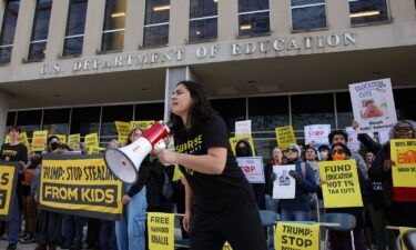 Demonstrators gather outside the offices of the U.S. Department of Education in Washington