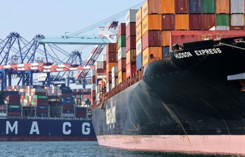 Shipping containers are stacked on container ships at the Port of Los Angeles on June 25. The port had its best June on record as importers raced to get ahead of higher tariffs.