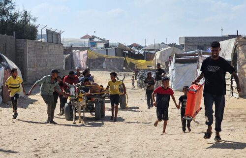 Palestinians in the southern Gaza Strip transport people who were injured while trying to get humanitarian aid on July 20.