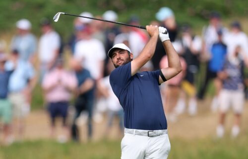 Scottie Scheffler hits his second shot on the 12th hole of The Open Championship on Sunday in Portrush