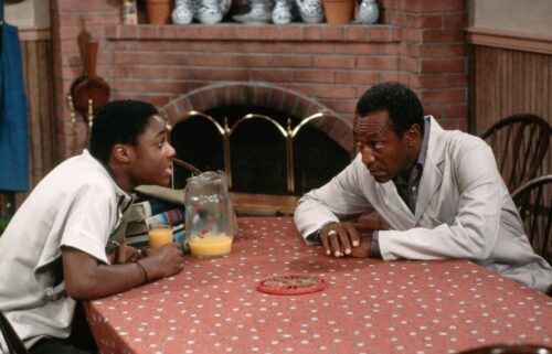 Warner and Bill Cosby are pictured in a scene from the "Cosby Show."