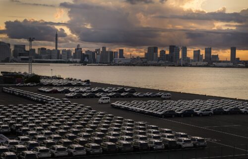 New Subaru vehicles bound for shipment at a port at dusk in Yokohama