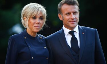 French President Emmanuel Macron and his wife Brigitte Macron arrive for a dinner during the 76th NATO Summit in The Hague