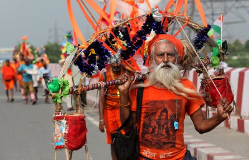 Lord Shiva devotees carry sacred Ganga Jal (holy water) during the ongoing Kanwar Yatra