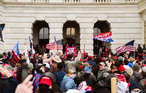 A pro-Trump mob floods into the Capitol Building after breaking into it on January 6